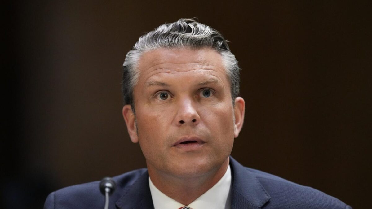 Defense Secretary Pete Hegseth sits and speaks at a Senate Committee Hearing