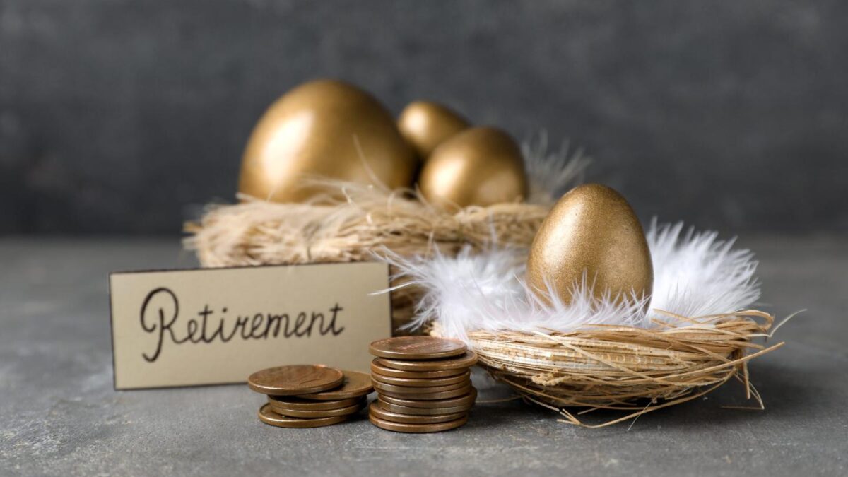 A nest of golden eggs with a sign that says Retirement.