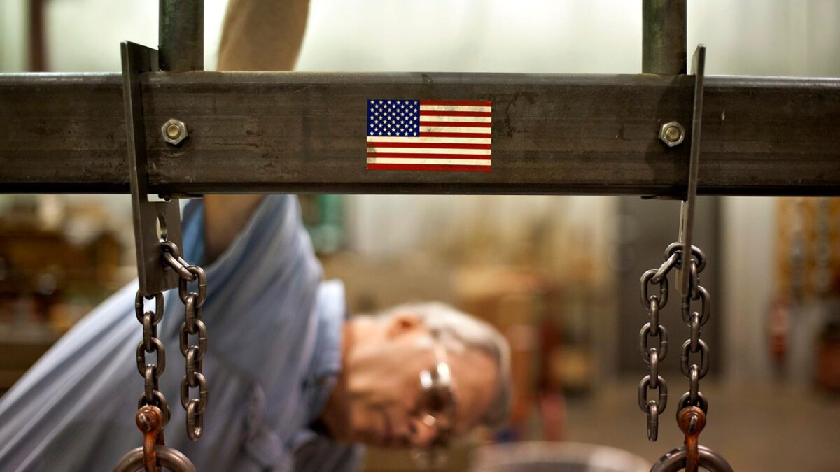 Employee William Meznarich reassembles the die for a punch press at the Badge-A-Minit facility in Oglesby, Illinois, U.S., on Friday, June 29, 2012.