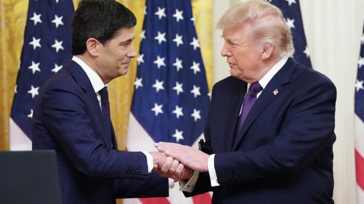 S President Donald Trump shakes hands with the new Chairman of the Federal Reserve Kevin Warsh (L) during a swearing in ceremony in the East Room of the White House in Washington, DC on May 22, 2026.