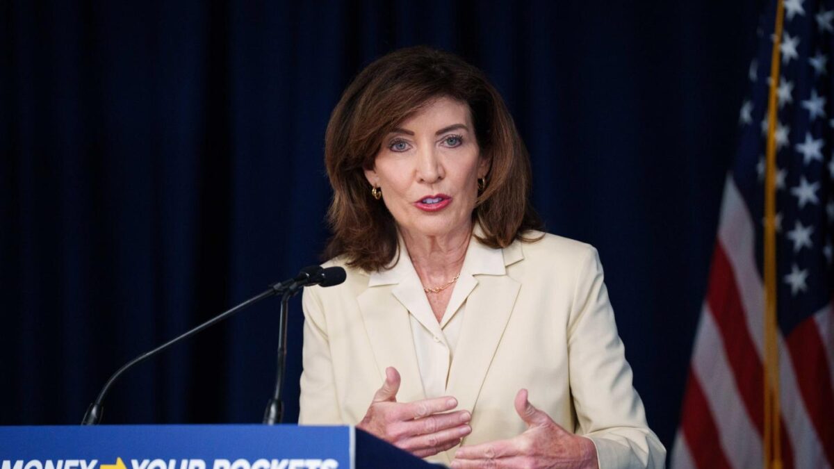 NYS Gov. Kathy Hochul standing at a podium