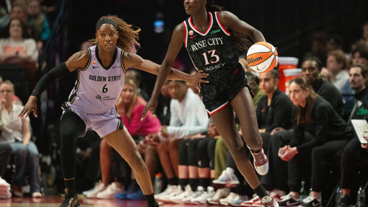 Nyadiew Puoch dribbles around Kaila Charles.