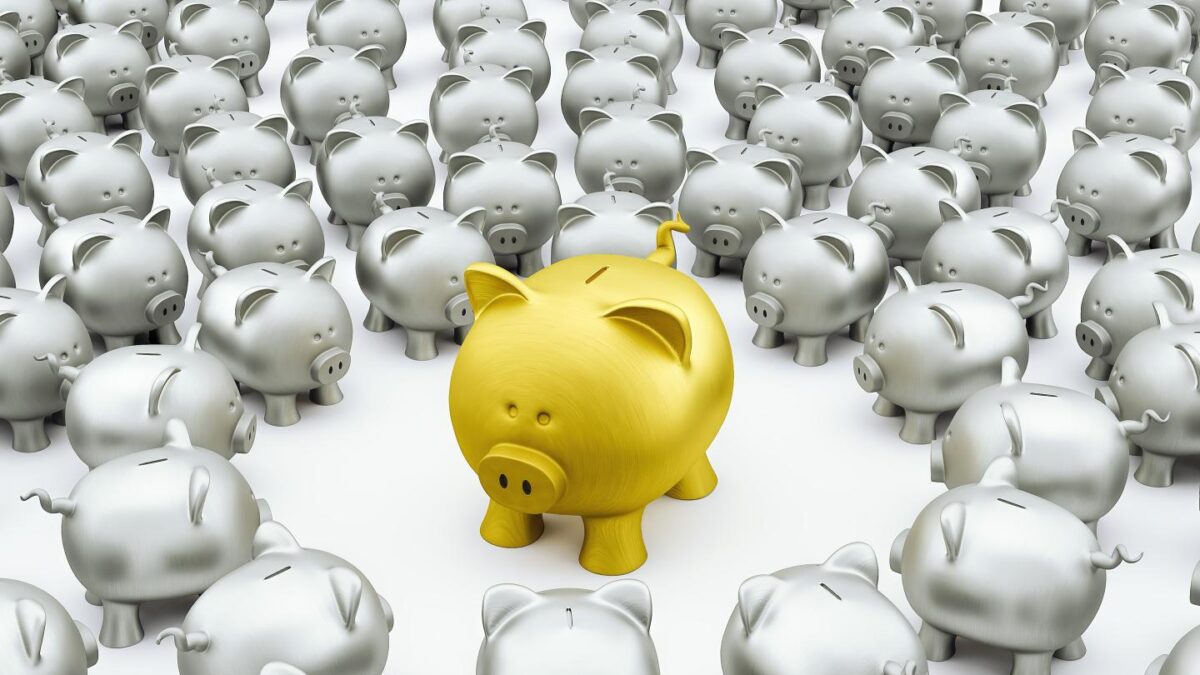 A gold piggy bank surrounded by smaller silver ones.